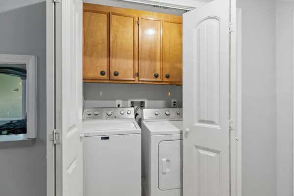 a kitchen with a stove a sink and a microwave