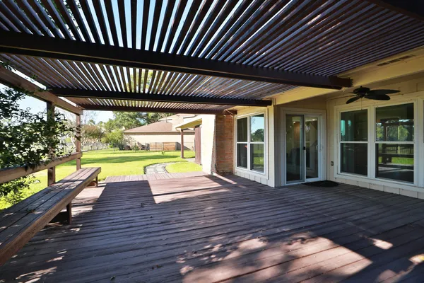 a view of a backyard with wooden floor