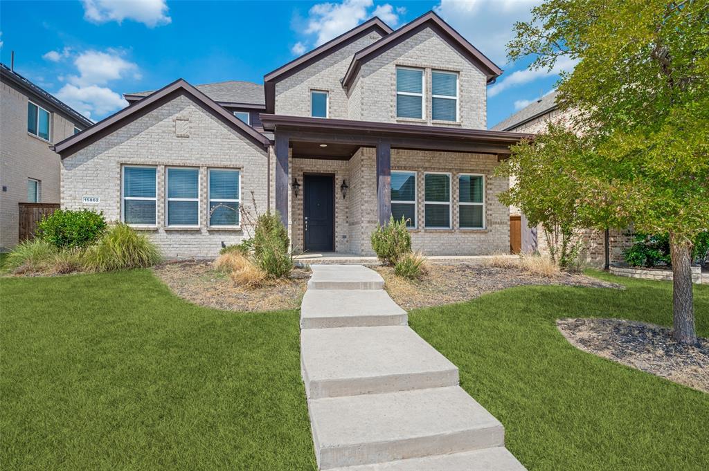 15862 Shasta Daisy Road Frisco, TX 75035 - Photo 1 of 15 Brick veneer exterior with dark trim accents and a covered front porch
