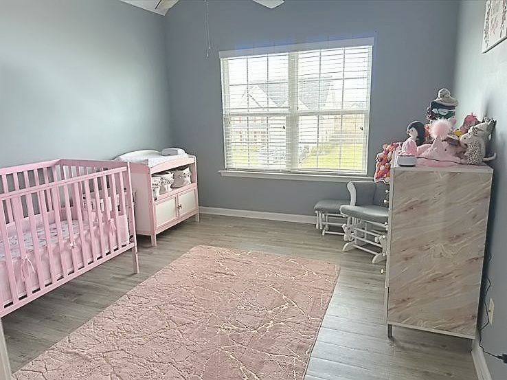 26 Apache Trail Fort Mitchell, AL 36856 - Photo 13 of 18 a bedroom with a bed and a window