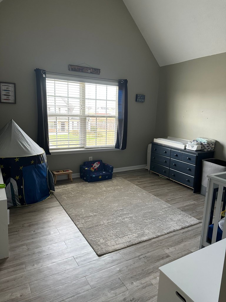 26 Apache Trail Fort Mitchell, AL 36856 - Photo 14 of 18 a spacious bedroom with a bed and a window