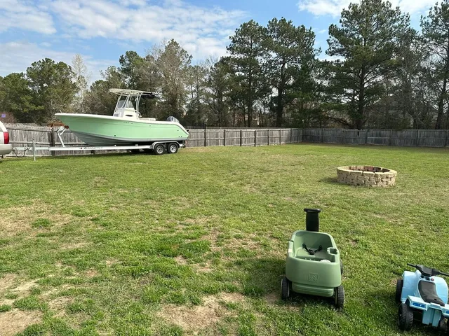 a view of a garden with lawn chairs