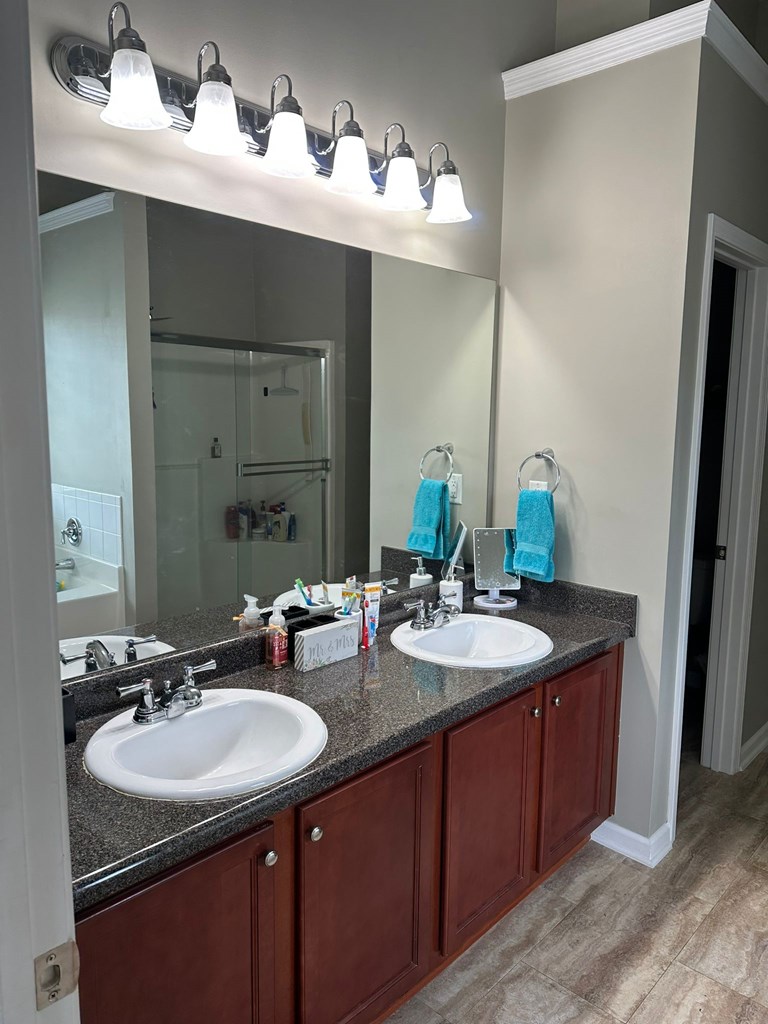 26 Apache Trail Fort Mitchell, AL 36856 - Photo 9 of 18 a bathroom with a sink and a mirror