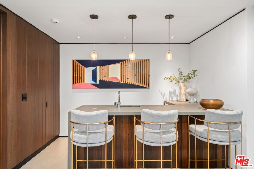 1005 Elden Way Beverly Hills, CA 90210 - Photo 12 of 62 a dining room with furniture and window