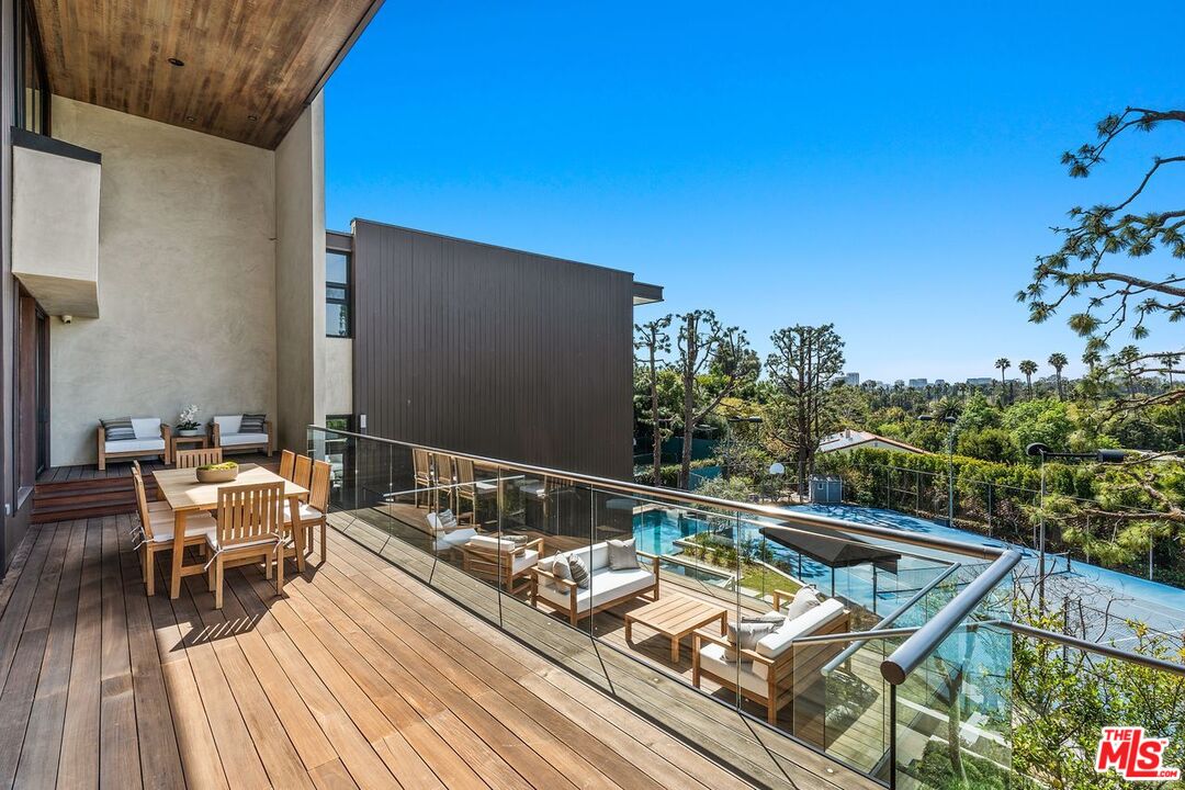 1005 Elden Way Beverly Hills, CA 90210 - Photo 19 of 62 a view of a balcony with chairs