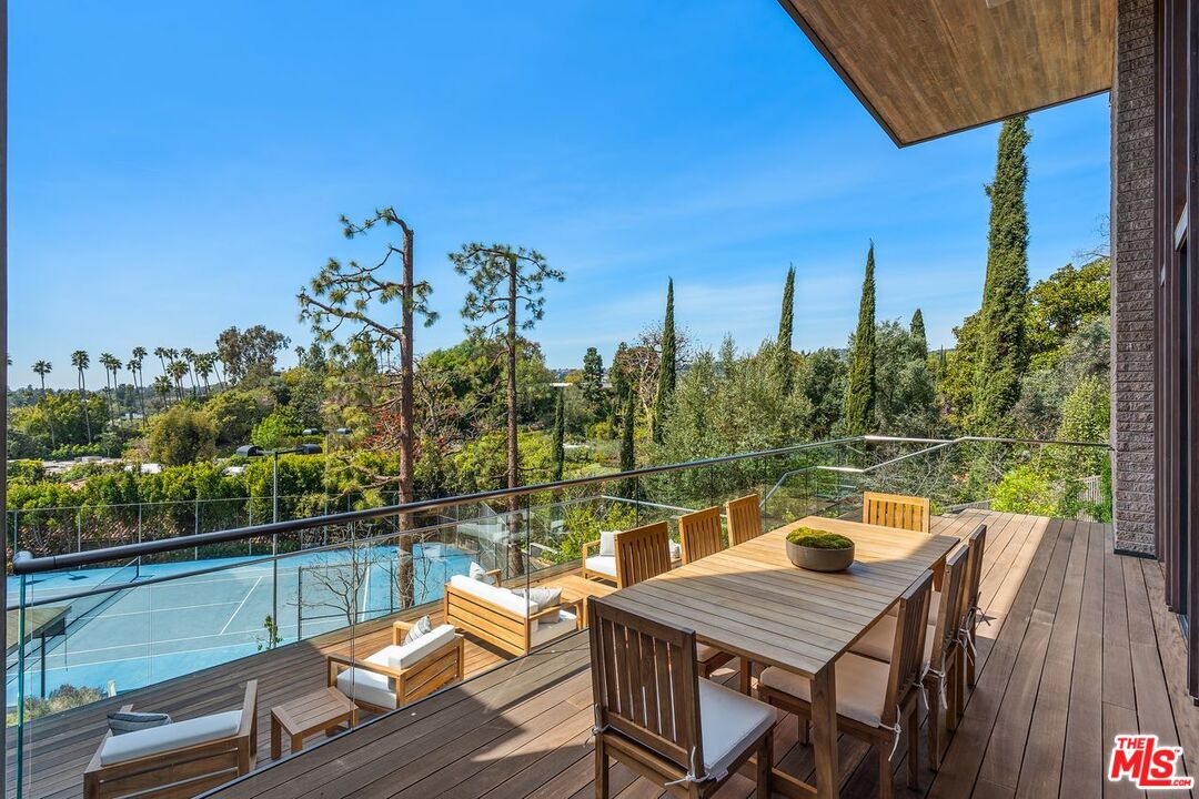 1005 Elden Way Beverly Hills, CA 90210 - Photo 20 of 62 a view of a balcony with two chairs and a table