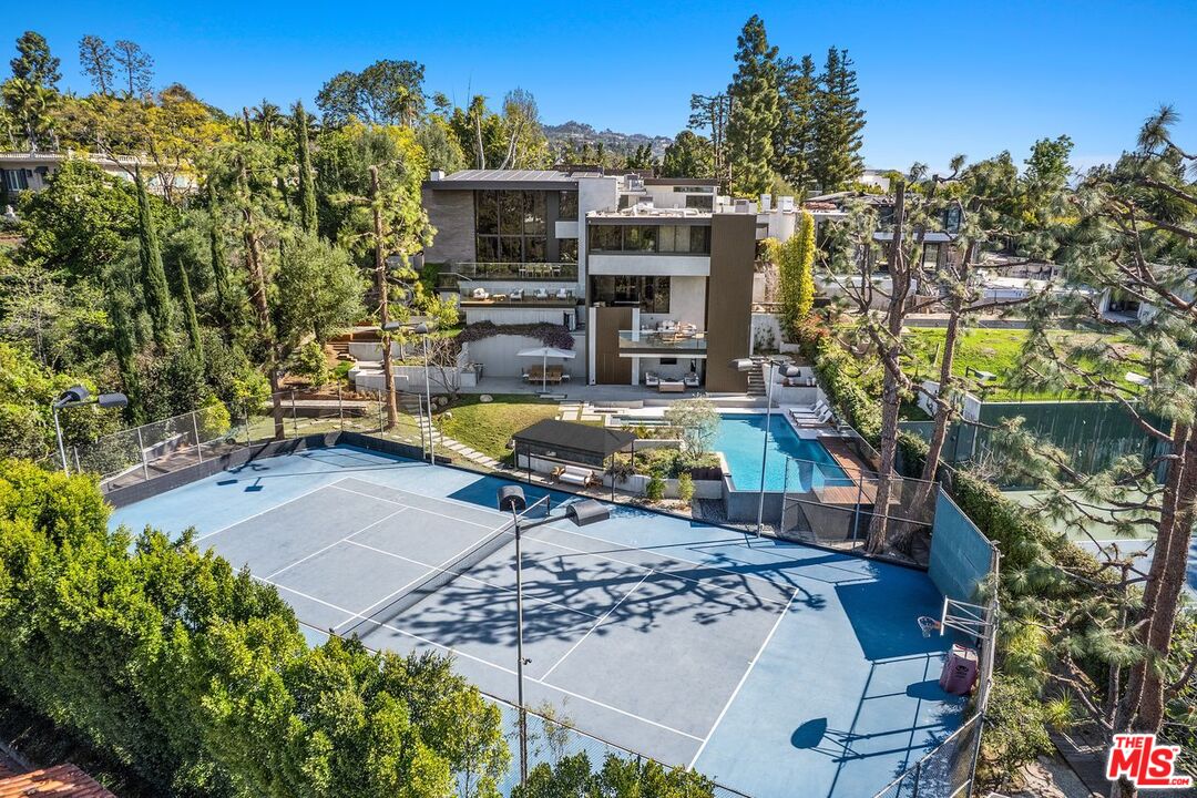 1005 Elden Way Beverly Hills, CA 90210 - Photo 2 of 62 a view of a swimming pool with sitting area