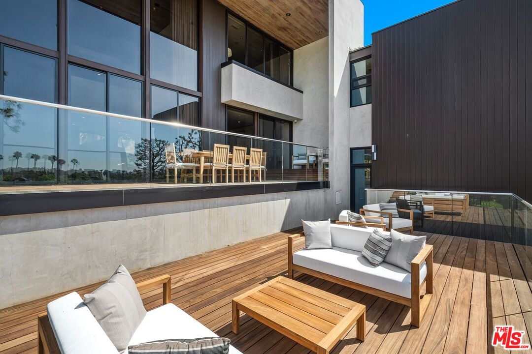 1005 Elden Way Beverly Hills, CA 90210 - Photo 23 of 62 a roof deck view with a couch