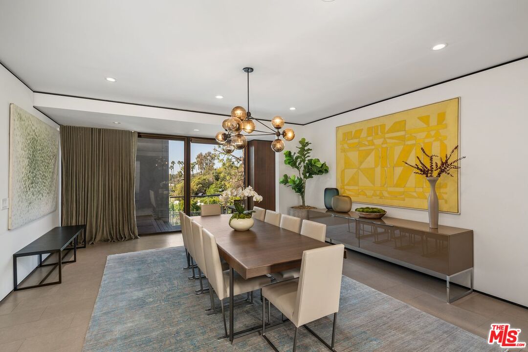 1005 Elden Way Beverly Hills, CA 90210 - Photo 24 of 62 a dining room with furniture and window