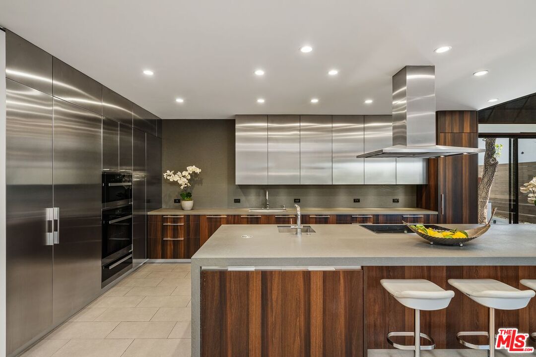 1005 Elden Way Beverly Hills, CA 90210 - Photo 28 of 62 a kitchen with a sink a counter space appliances and cabinets