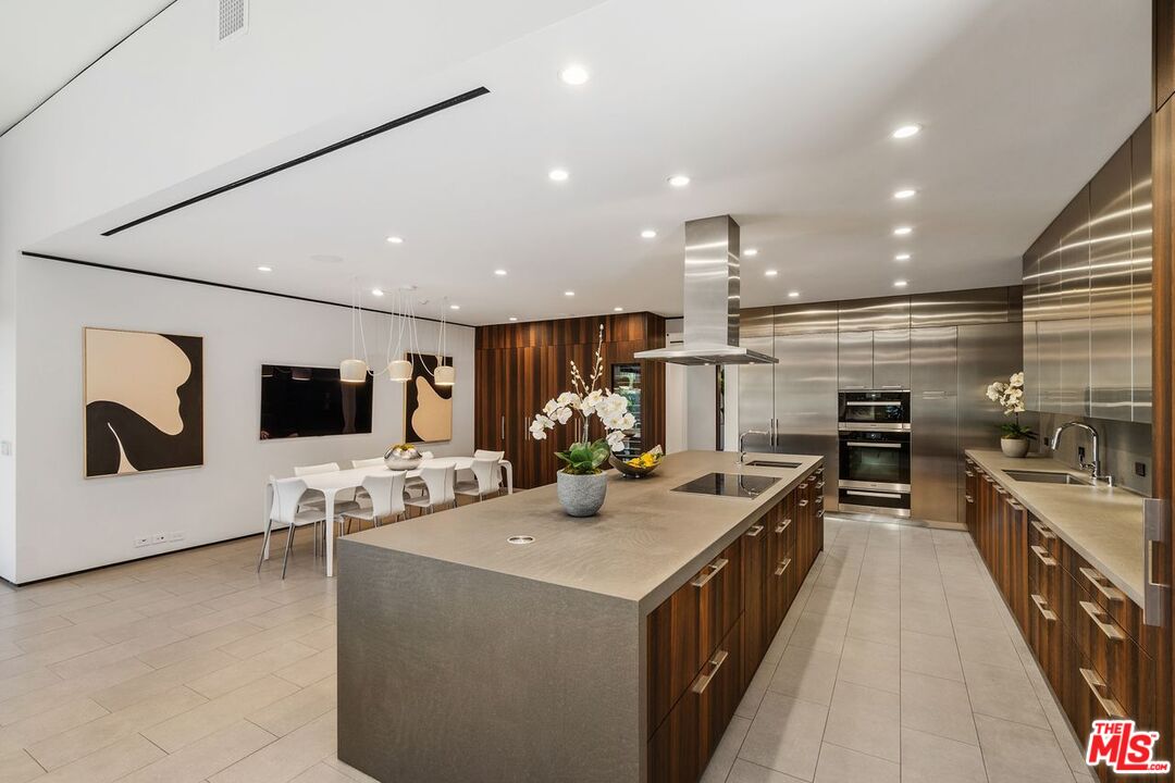 1005 Elden Way Beverly Hills, CA 90210 - Photo 29 of 62 a kitchen with a sink and wooden floor