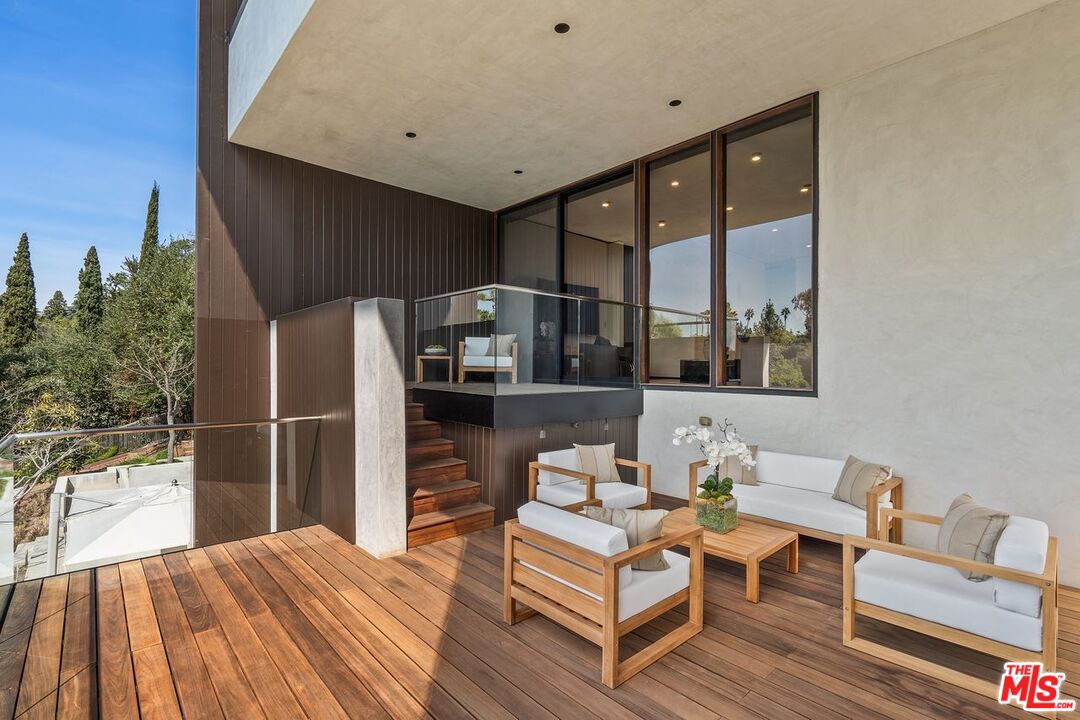 1005 Elden Way Beverly Hills, CA 90210 - Photo 34 of 62 a outdoor living space with furniture and a potted plant