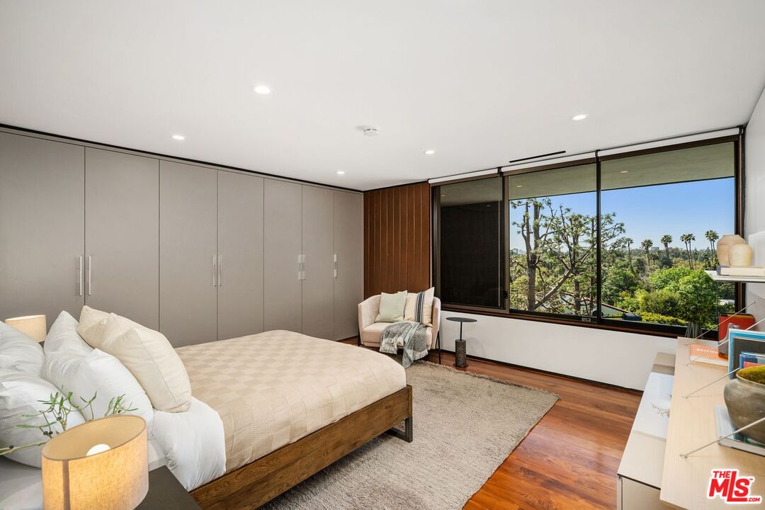 1005 Elden Way Beverly Hills, CA 90210 - Photo 46 of 62 a bedroom with a bed and window