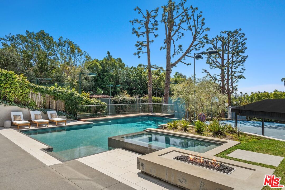1005 Elden Way Beverly Hills, CA 90210 - Photo 51 of 62 a view of a house with swimming pool and sitting area