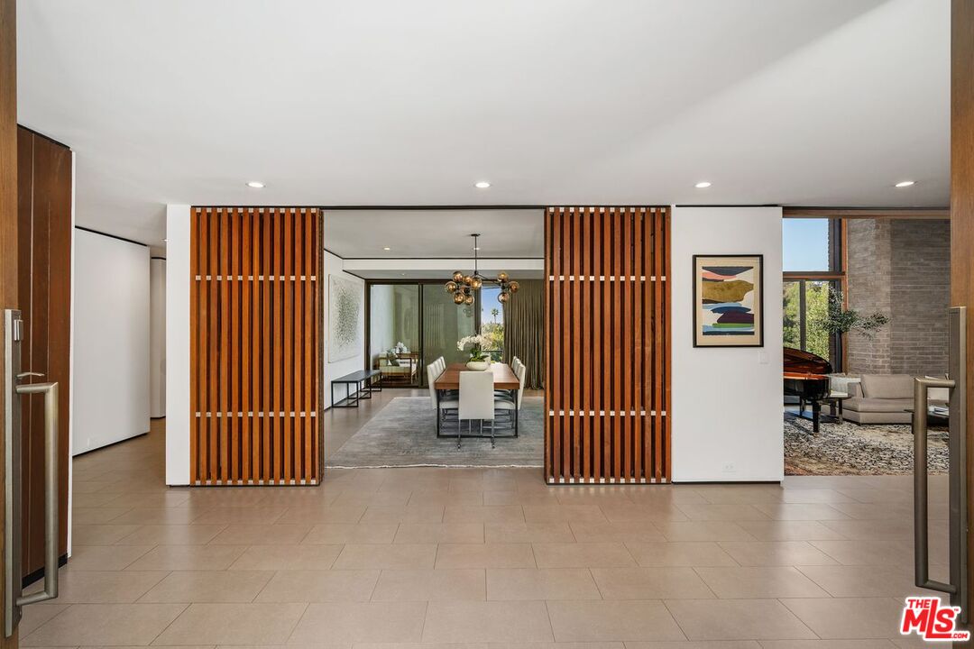 1005 Elden Way Beverly Hills, CA 90210 - Photo 10 of 62 a view of a livingroom with furniture and staircase
