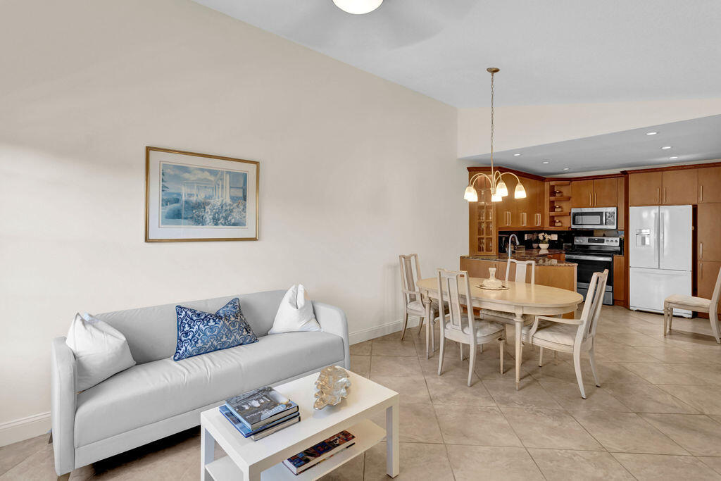 121 Waterside Drive Hypoluxo, FL 33462 - Photo 1 of 22 a living room with furniture and kitchen view