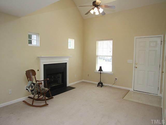 5518 Golden Moss Trail Raleigh, NC 27613 - Photo 2 of 13 Family room features vaulted celiings, gas fireplace and ceiling fan. Den/Family/Great Room