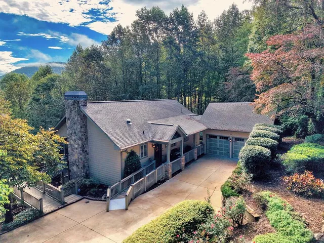 a aerial view of a house with a yard