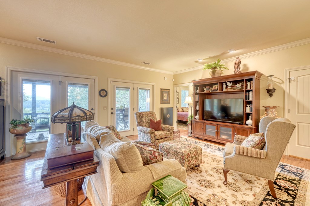 197 Eagles View Road Hayesville, NC 28904 - Photo 13 of 53 a living room with furniture and a flat screen tv