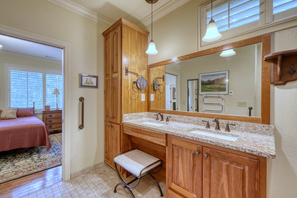 197 Eagles View Road Hayesville, NC 28904 - Photo 21 of 53 a en suite bathroom with a granite countertop sink a toilet a mirror and shower