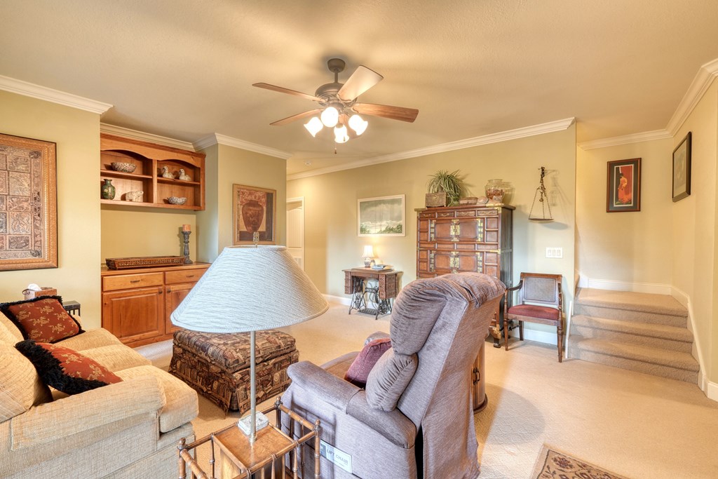 197 Eagles View Road Hayesville, NC 28904 - Photo 24 of 53 a living room with furniture and a chandelier