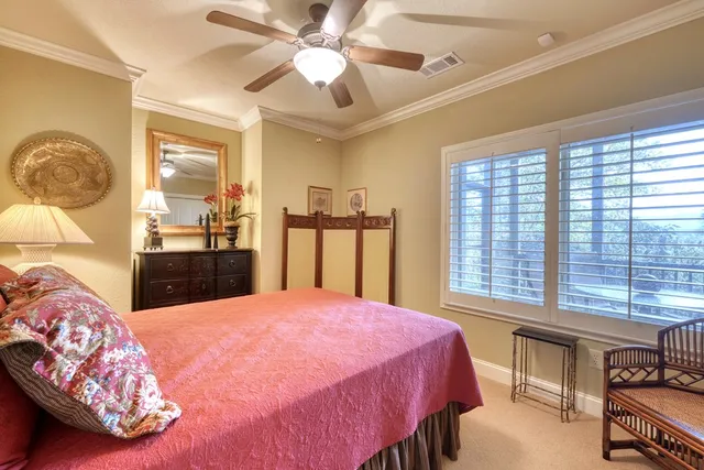 a bed room with a bed and a chandelier