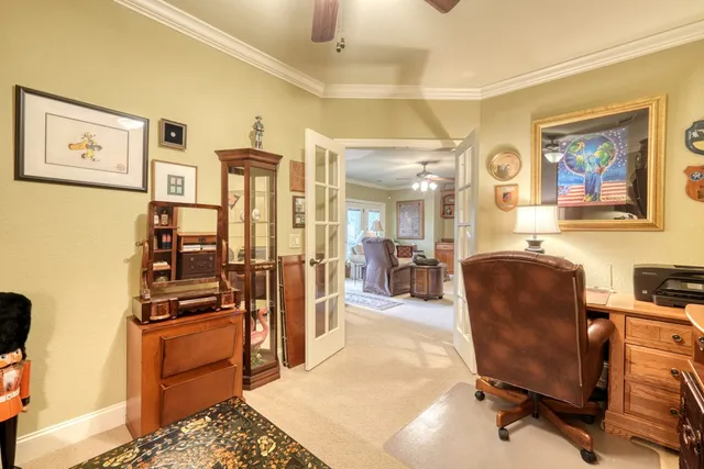 a view of a livingroom with workspace and a couch