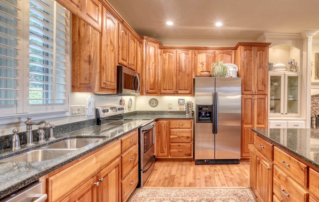 197 Eagles View Road Hayesville, NC 28904 - Photo 10 of 53 a kitchen with stainless steel appliances granite countertop a refrigerator a sink a stove and island
