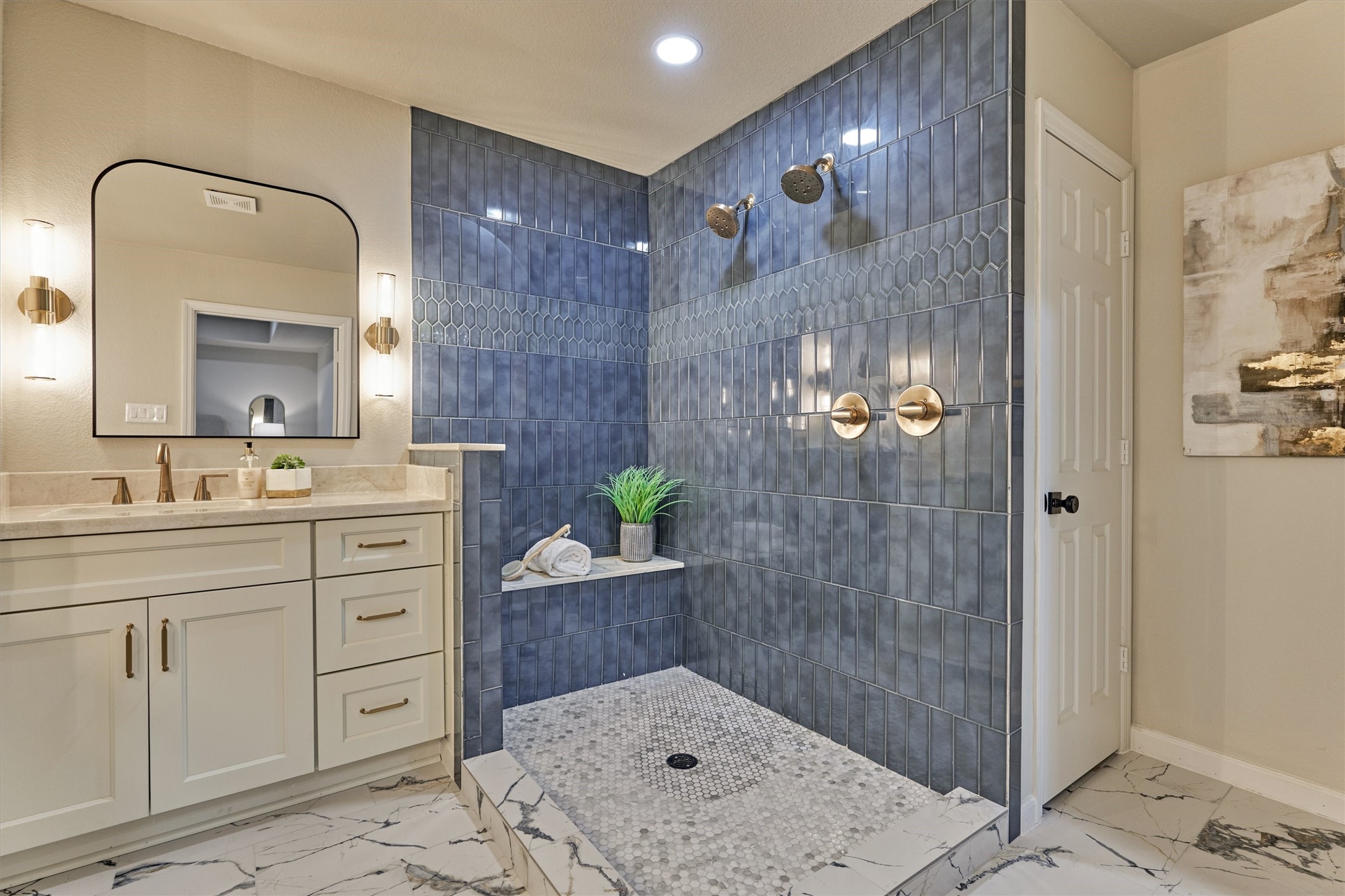 6107 Jadecrest Court Spring, TX 77389 - Photo 23 of 40 a bathroom with a sink a mirror and a shower