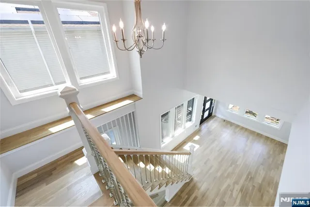a view of an entryway with wooden floor
