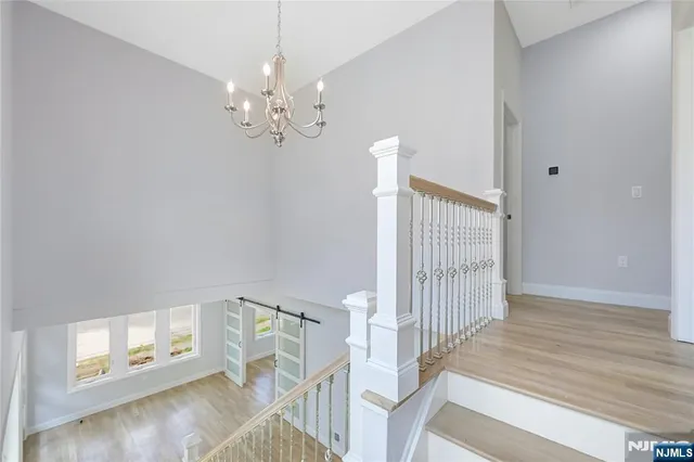 a view of an entryway with wooden floor