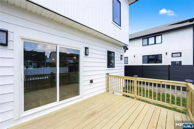 a view of a balcony with wooden floor