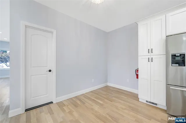 a view of a kitchen with a refrigerator