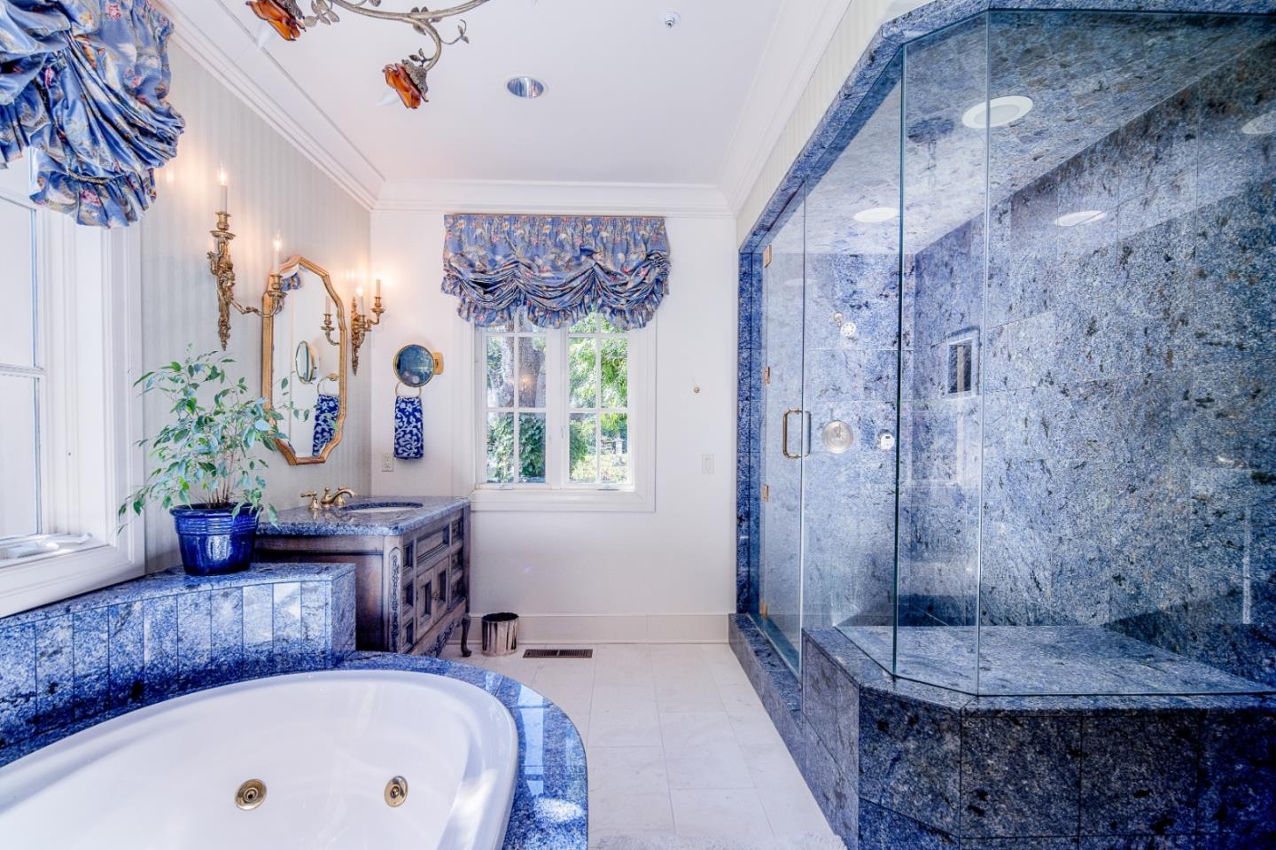 12 Ring Lane Carmel Valley, CA 93924 - Photo 39 of 73 a bathroom with a tub sink and mirror