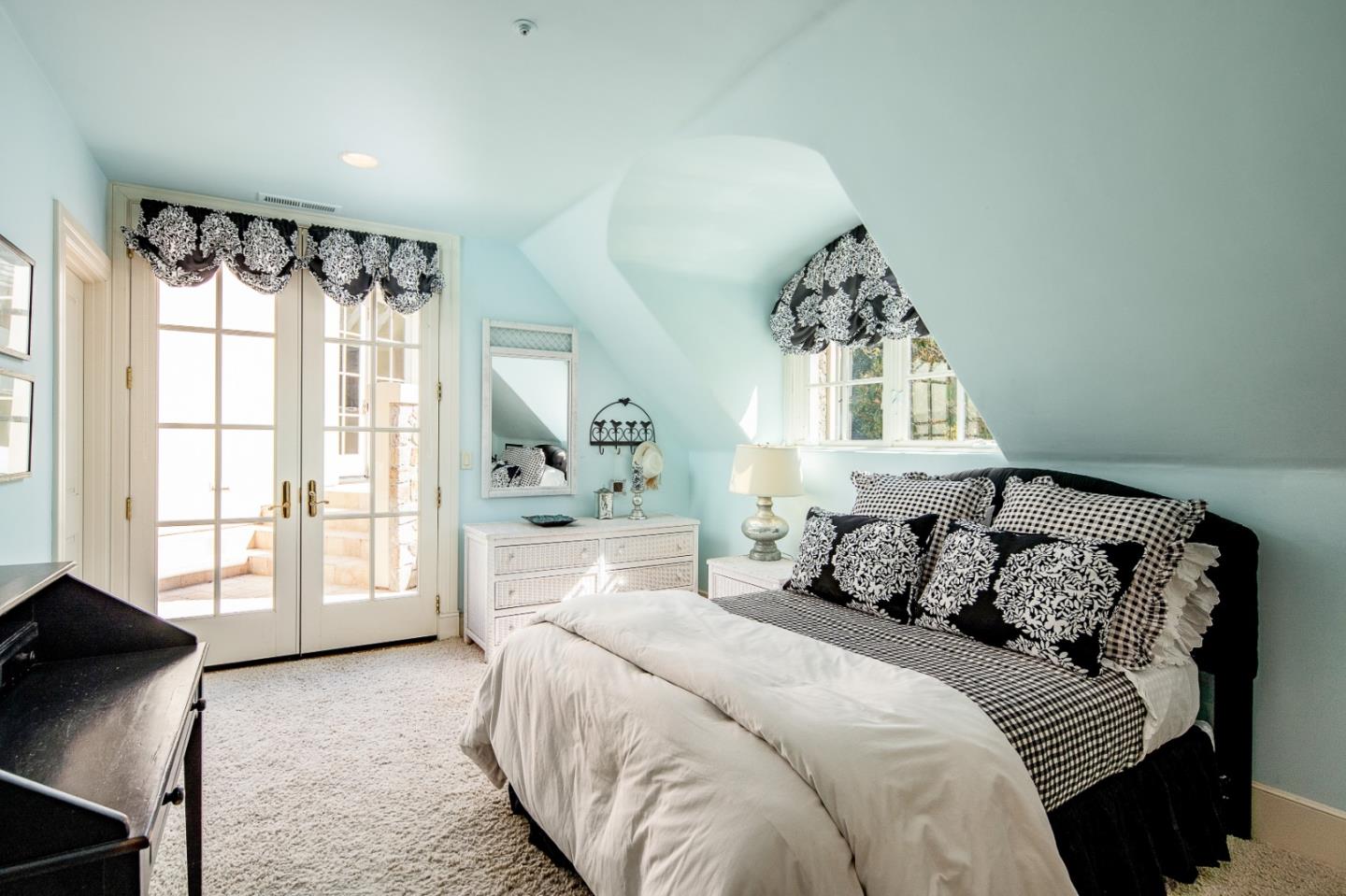 12 Ring Lane Carmel Valley, CA 93924 - Photo 49 of 73 a bedroom with a bed mirror and window