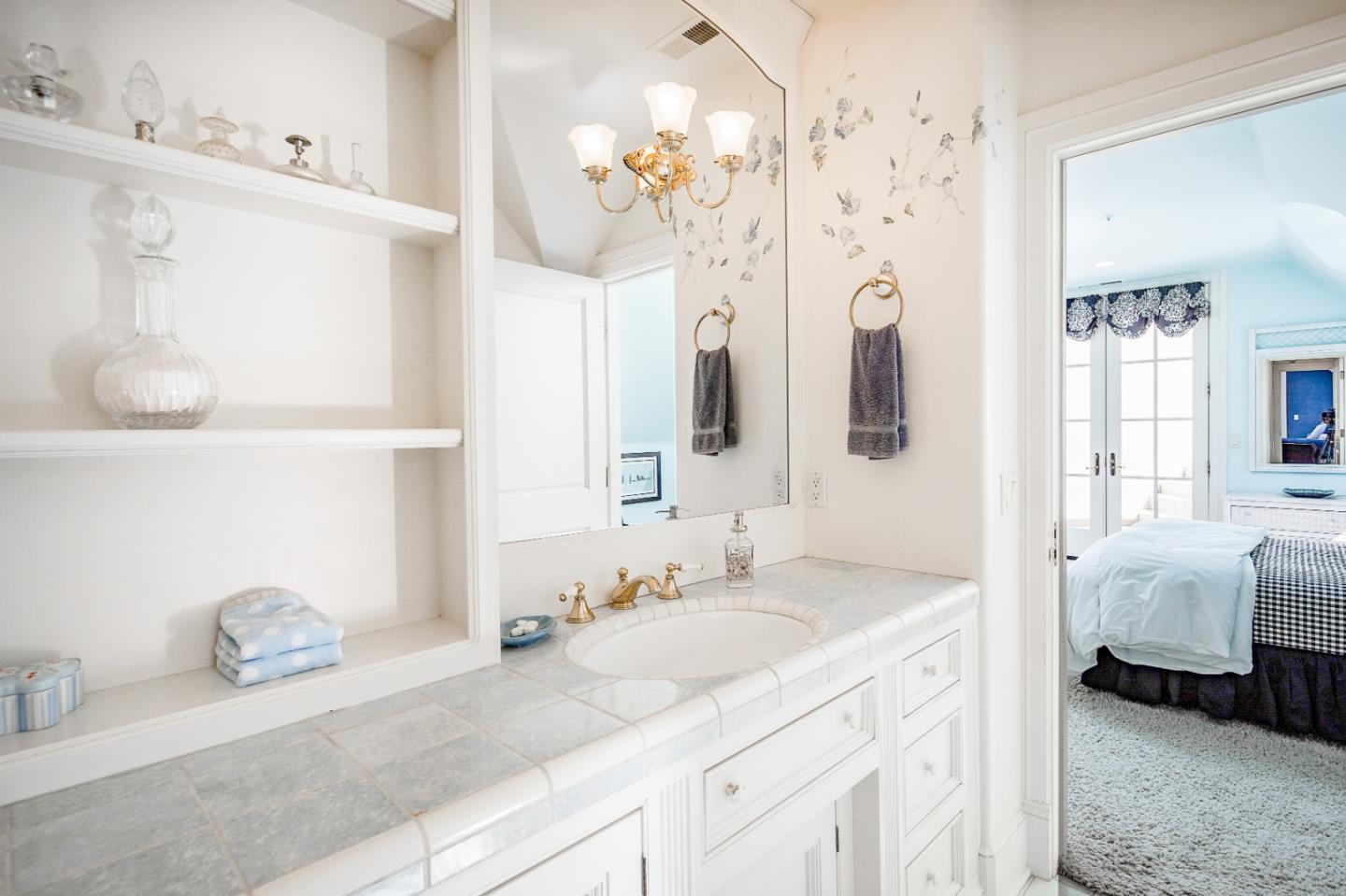 12 Ring Lane Carmel Valley, CA 93924 - Photo 51 of 73 a en suite bathroom with a double vanity sink mirror and