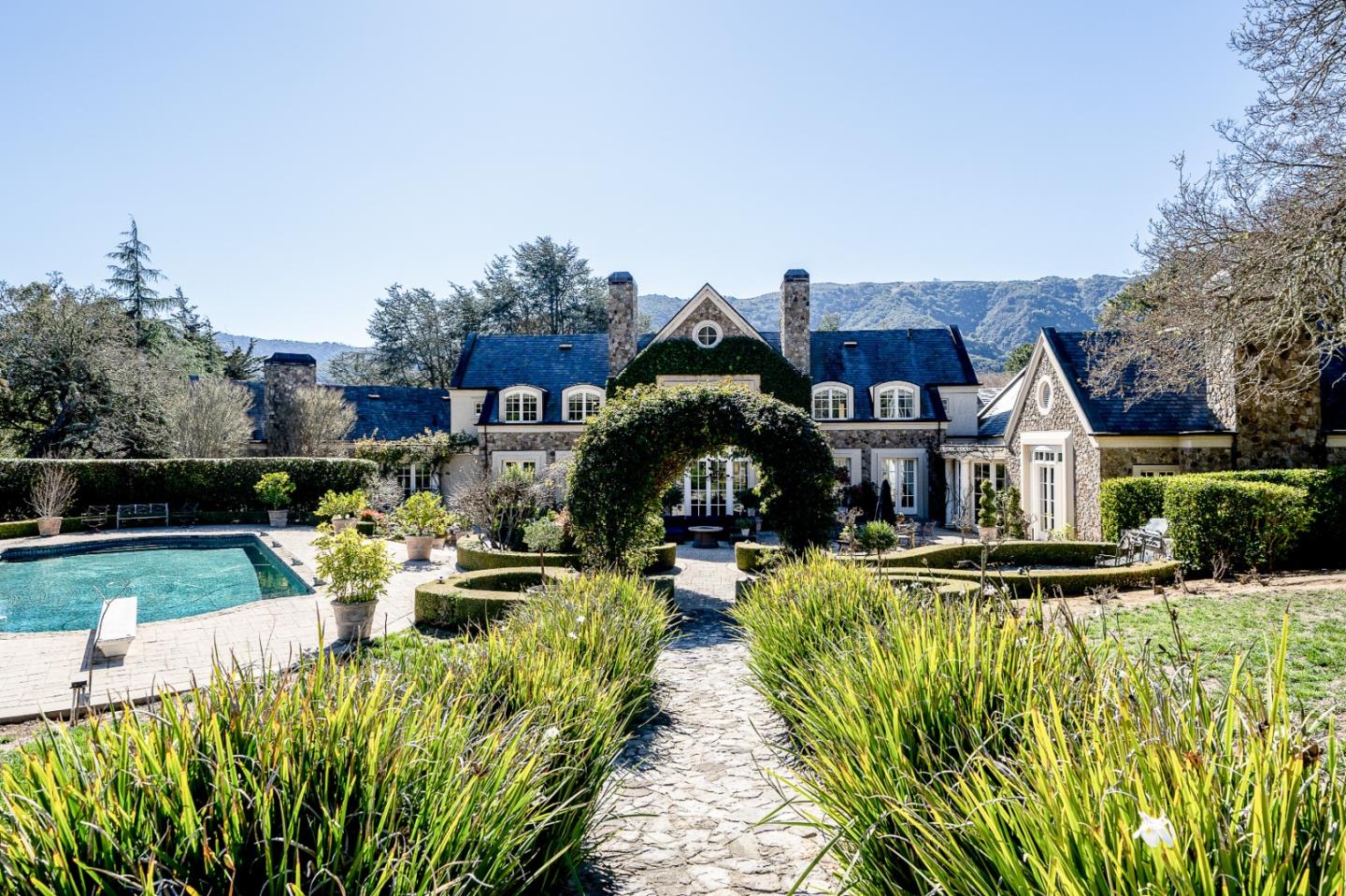 12 Ring Lane Carmel Valley, CA 93924 - Photo 65 of 73 a front view of a house with swimming pool and sitting area