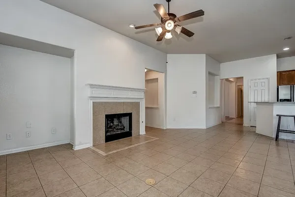 a view of a livingroom with kitchen and furniture