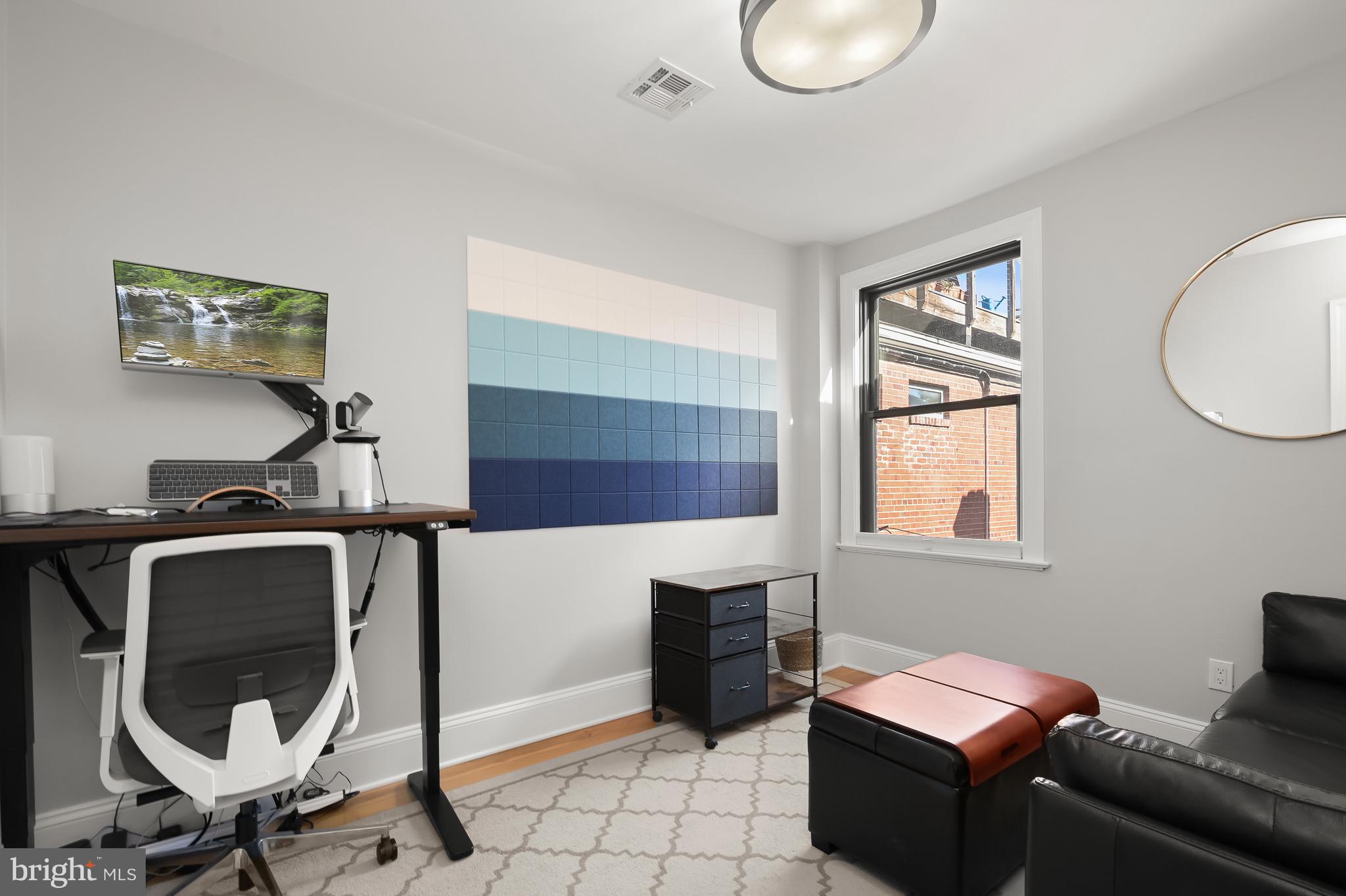 1733 11th Street Northwest Washington, DC 20001 - Photo 14 of 21 a living room with furniture and a window