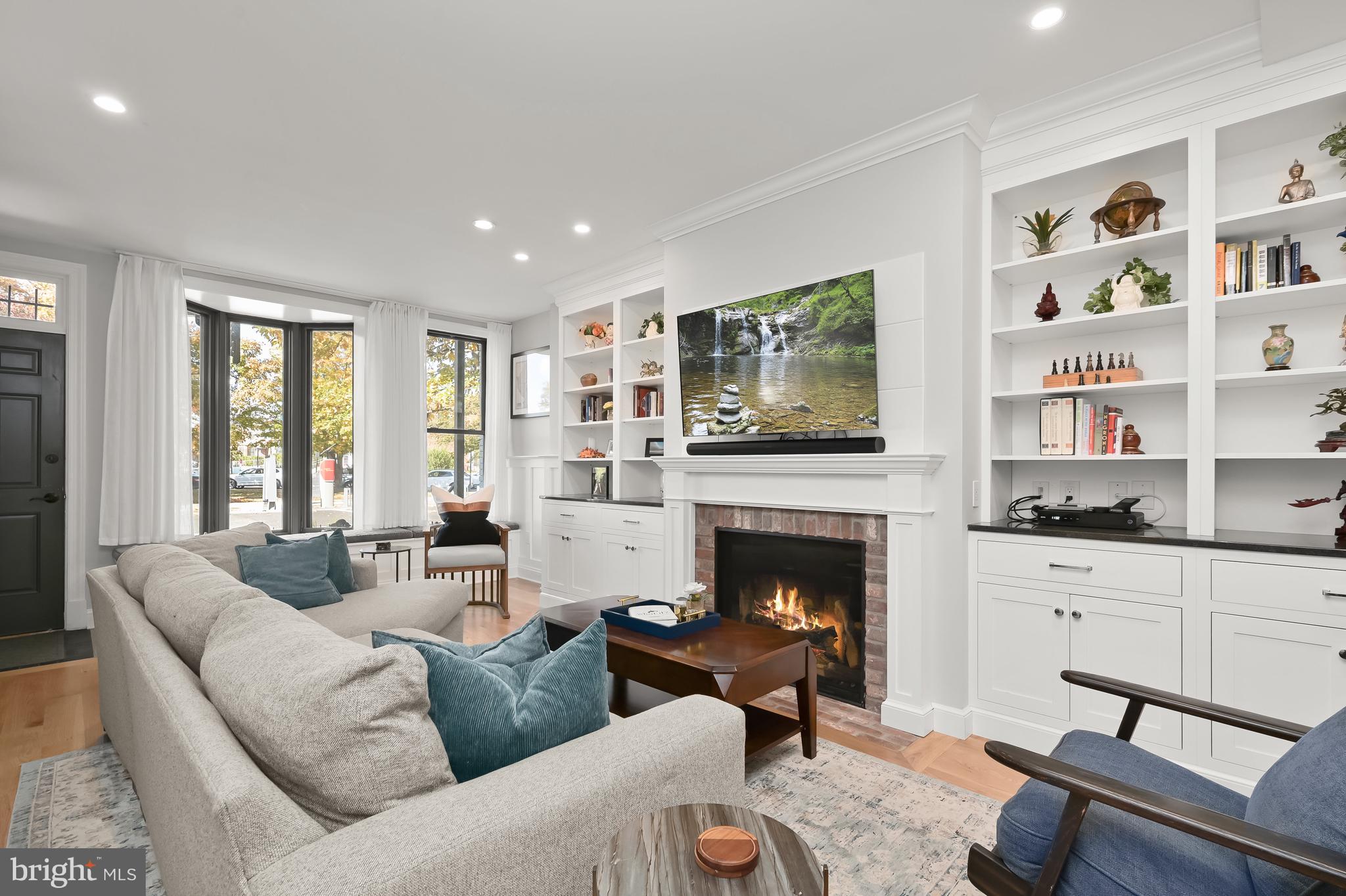 1733 11th Street Northwest Washington, DC 20001 - Photo 3 of 21 a living room with furniture fireplace and window
