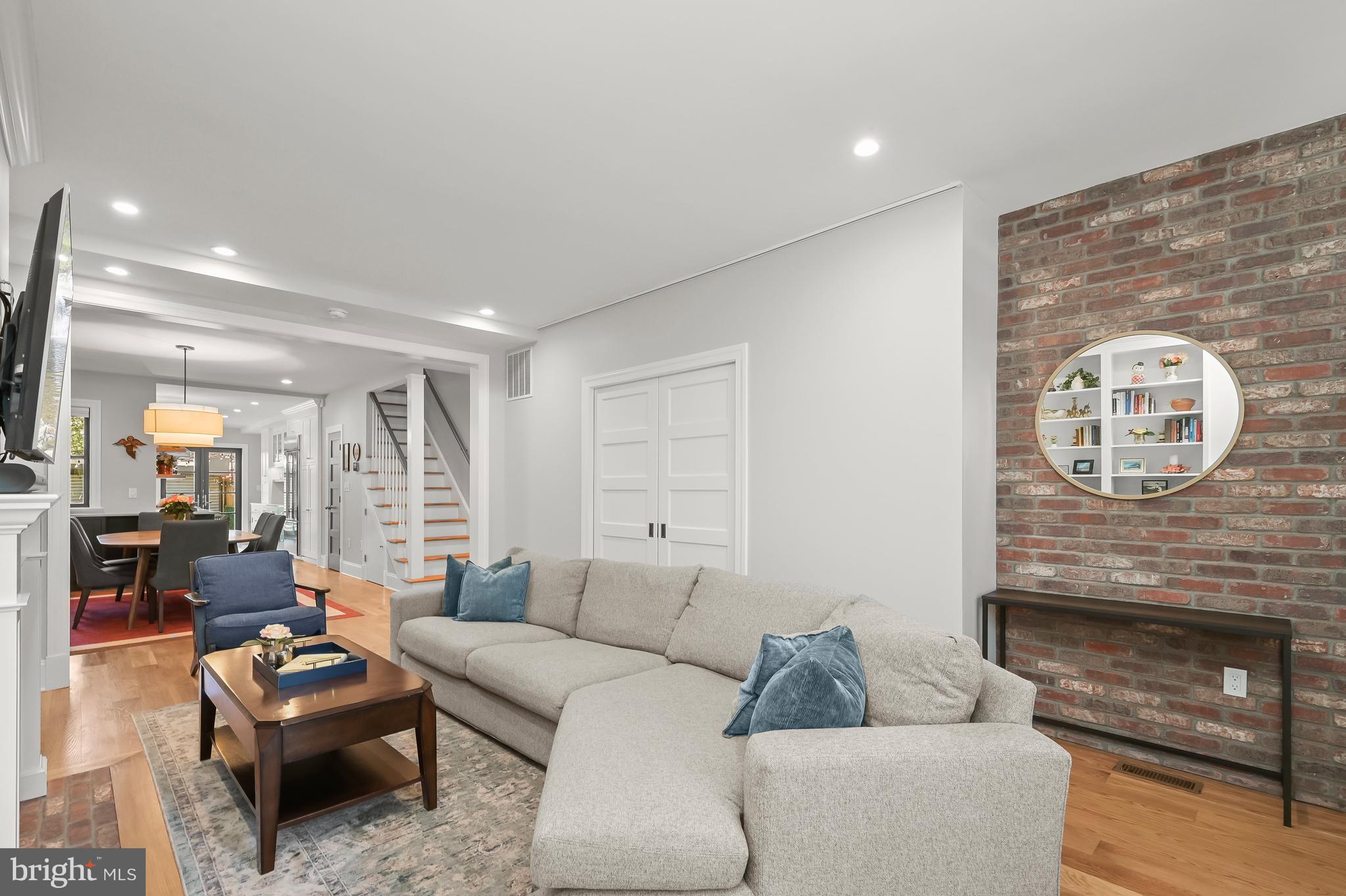 1733 11th Street Northwest Washington, DC 20001 - Photo 4 of 21 a living room with furniture and a fireplace
