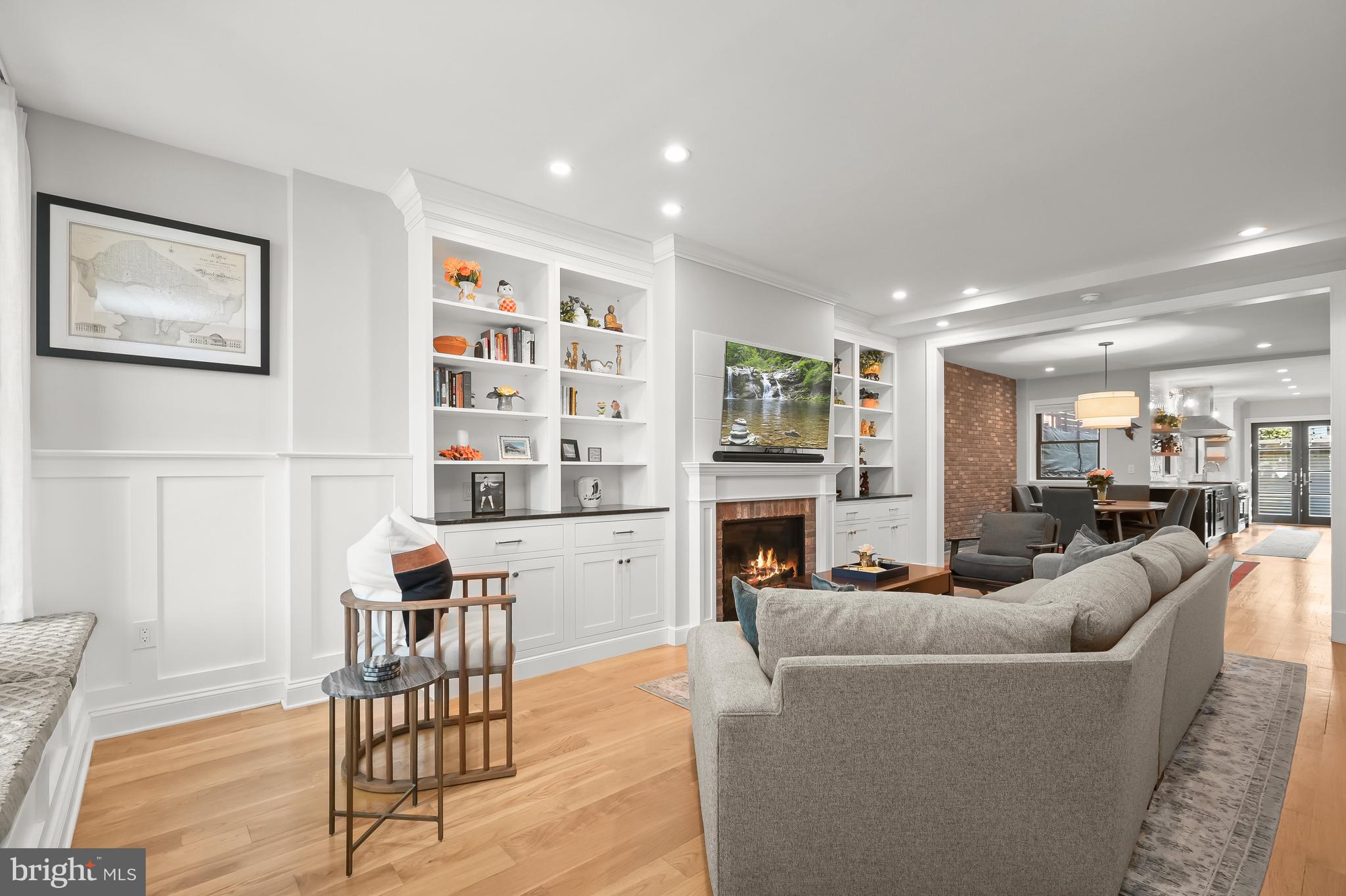 1733 11th Street Northwest Washington, DC 20001 - Photo 5 of 21 a living room with furniture and a fireplace