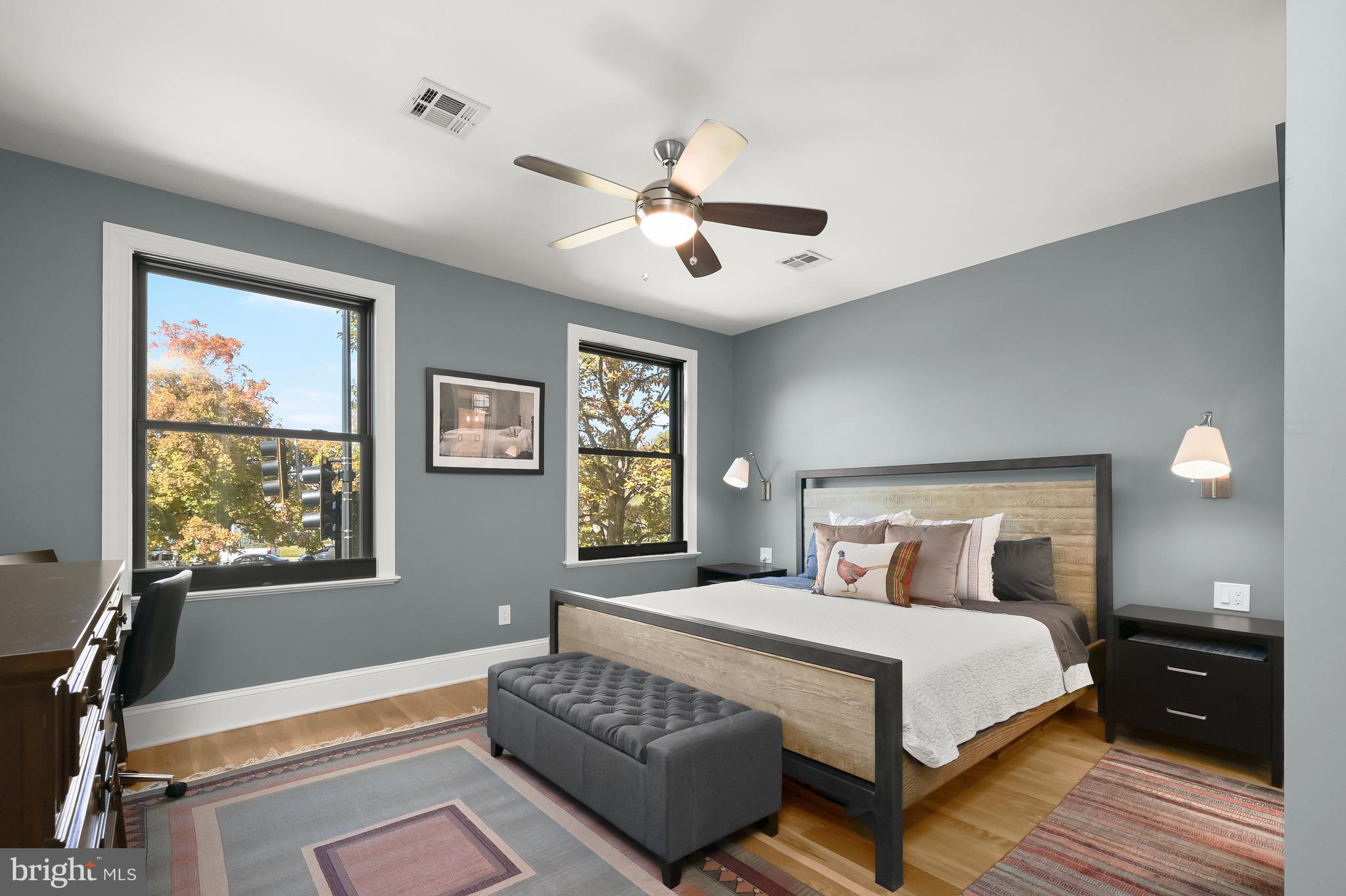 1733 11th Street Northwest Washington, DC 20001 - Photo 10 of 21 a bedroom with a large bed and a chandelier