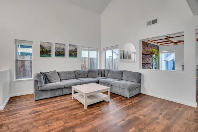 a living room with furniture and a window