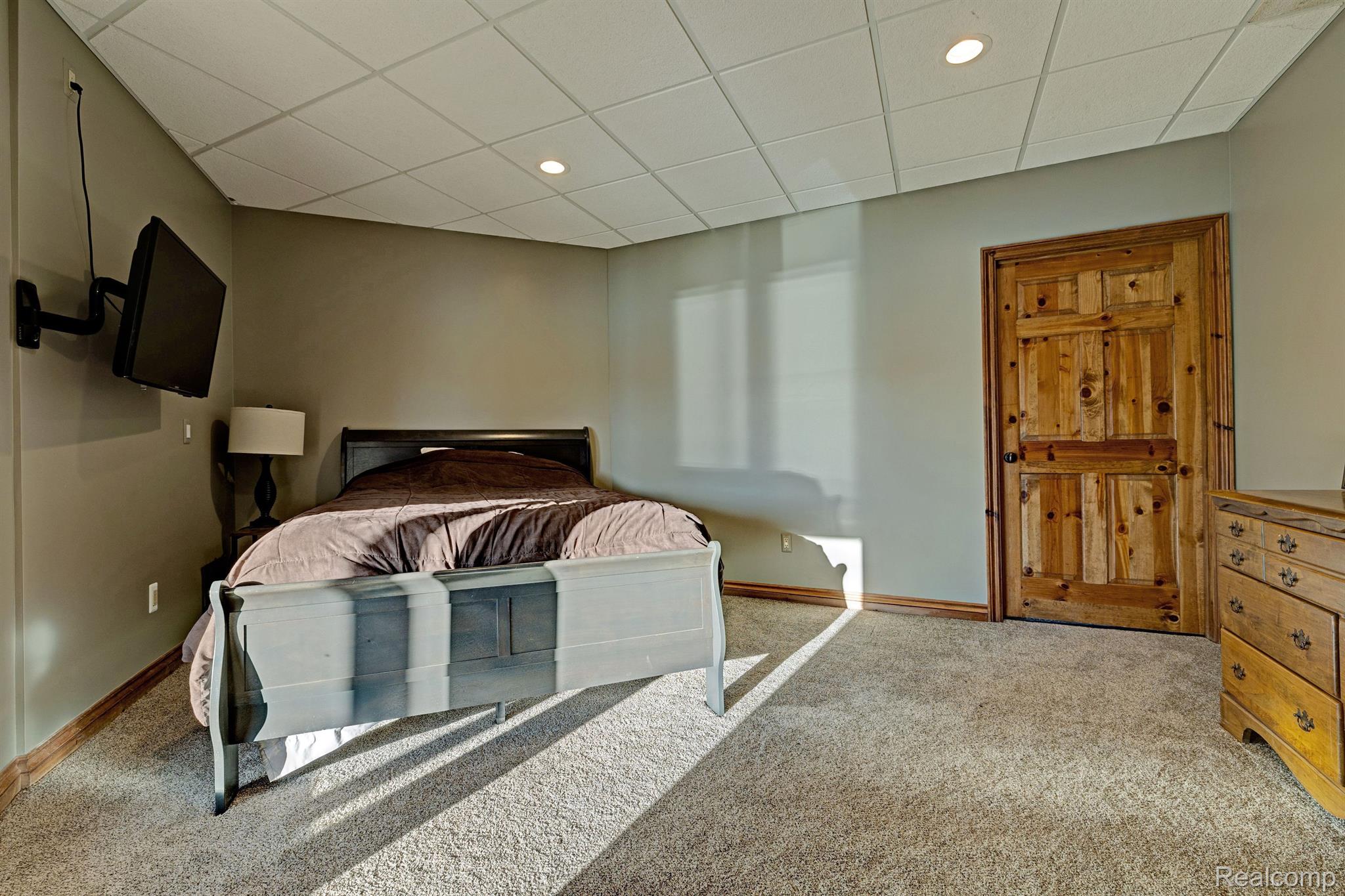 1372 McKail Road Leonard, MI 48367 - Photo 48 of 92 Basement bedroom