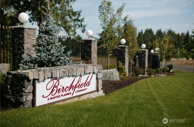a bathroom with a shower and a mirror