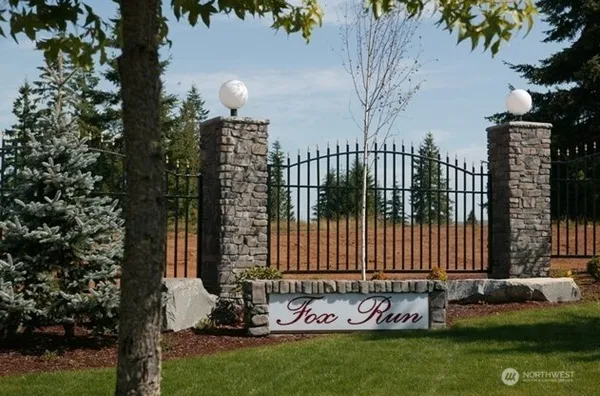 a view of a playground with basketball court