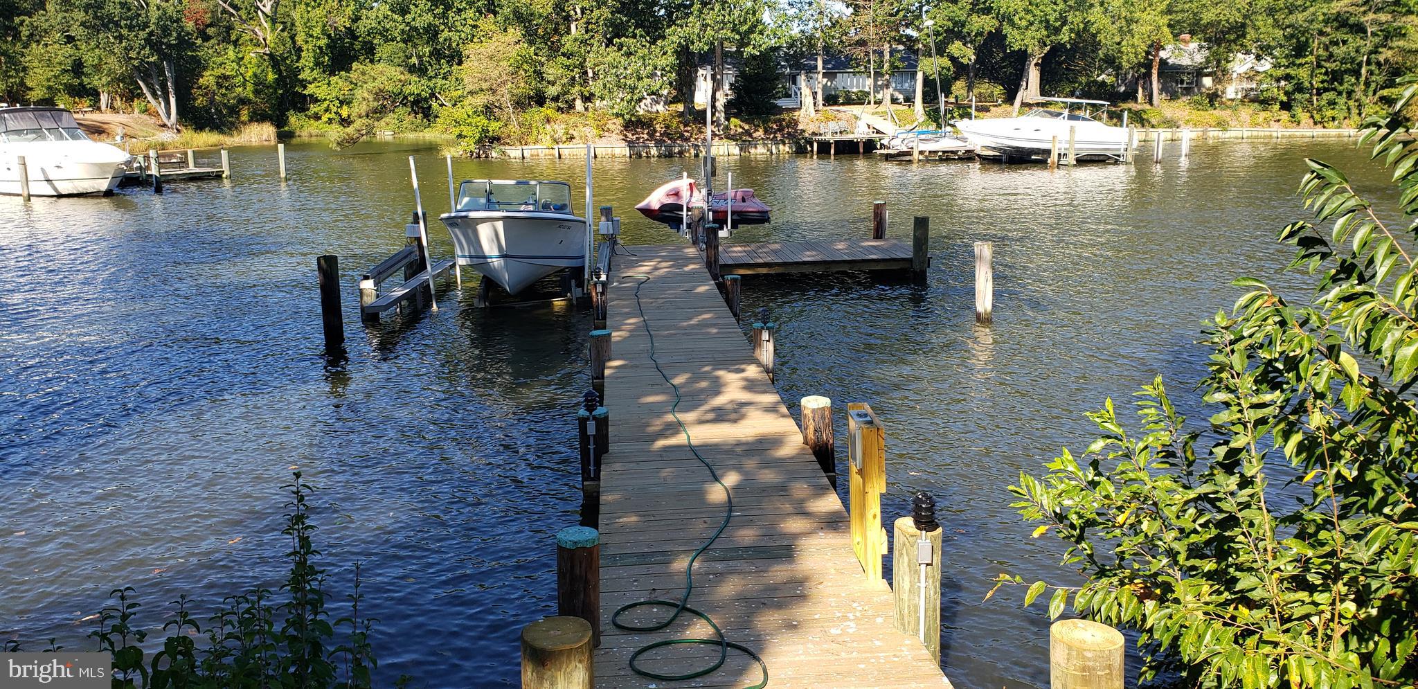 317 Pigpen Point Road Queenstown, MD 21658 - Photo 9 of 42 Dock with electric, boat lift and jest ski lift