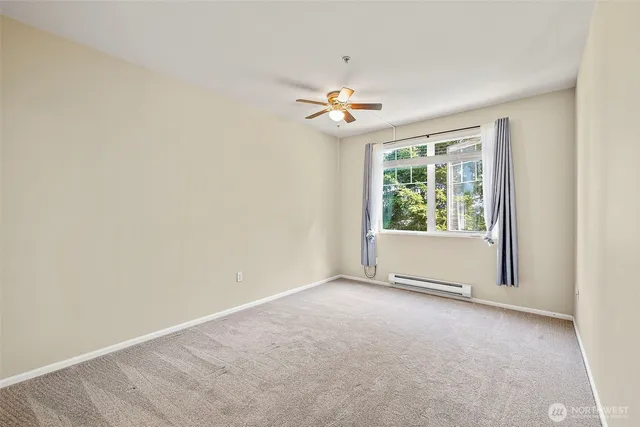 a bathroom with a granite countertop sink a toilet and a mirror