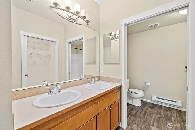 a bathroom with a shower and a bath tub